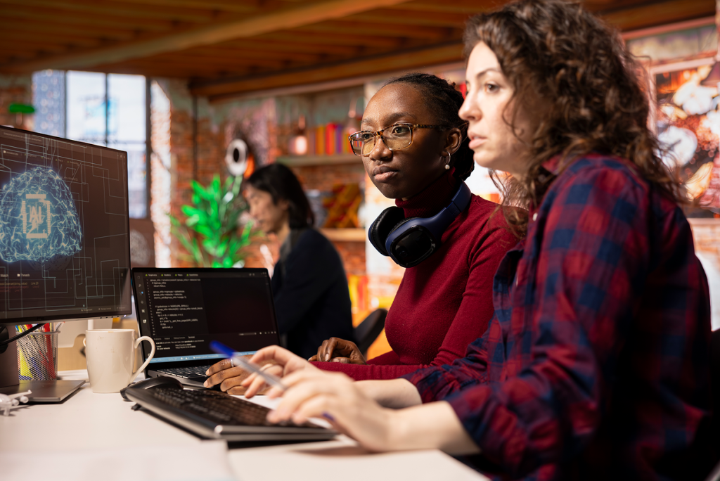 2 female looking at screen